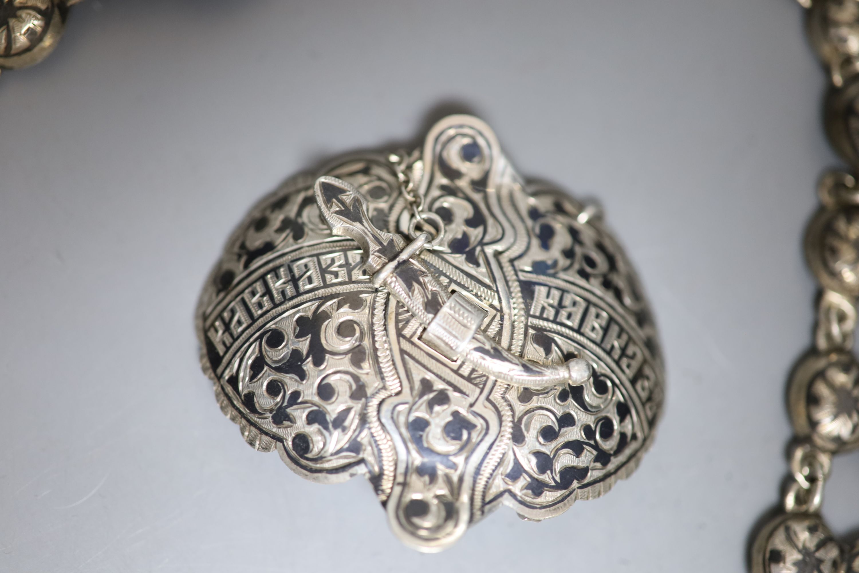 A late 19th/early 20th century Russian 84 zolotnik and niello belt, 59cm, and buckle and one other similar buckle